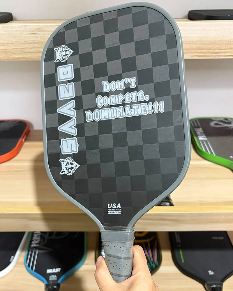 A high-performance pickleball paddle featuring a 12K carbon fiber weave, offering a perfect balance between lightweight handling and explosive power for competitive play.