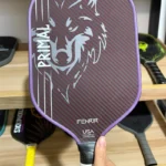A high-performance pickleball paddle featuring a 3K carbon fiber weave surface, providing exceptional stiffness and a powerful strike for professional players.