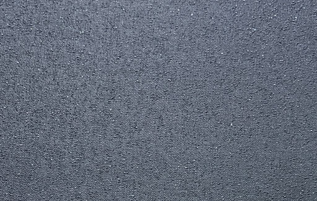 Close-up of a silicon carbide textured surface on a custom pickleball paddle